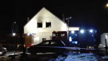 Nadpalony budynek otoczony taśmą